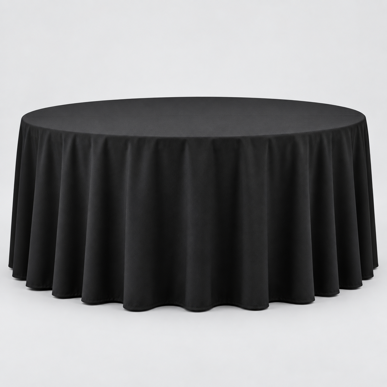 72-inch round table dressed with a black 132-inch floor-length linen that reaches the ground