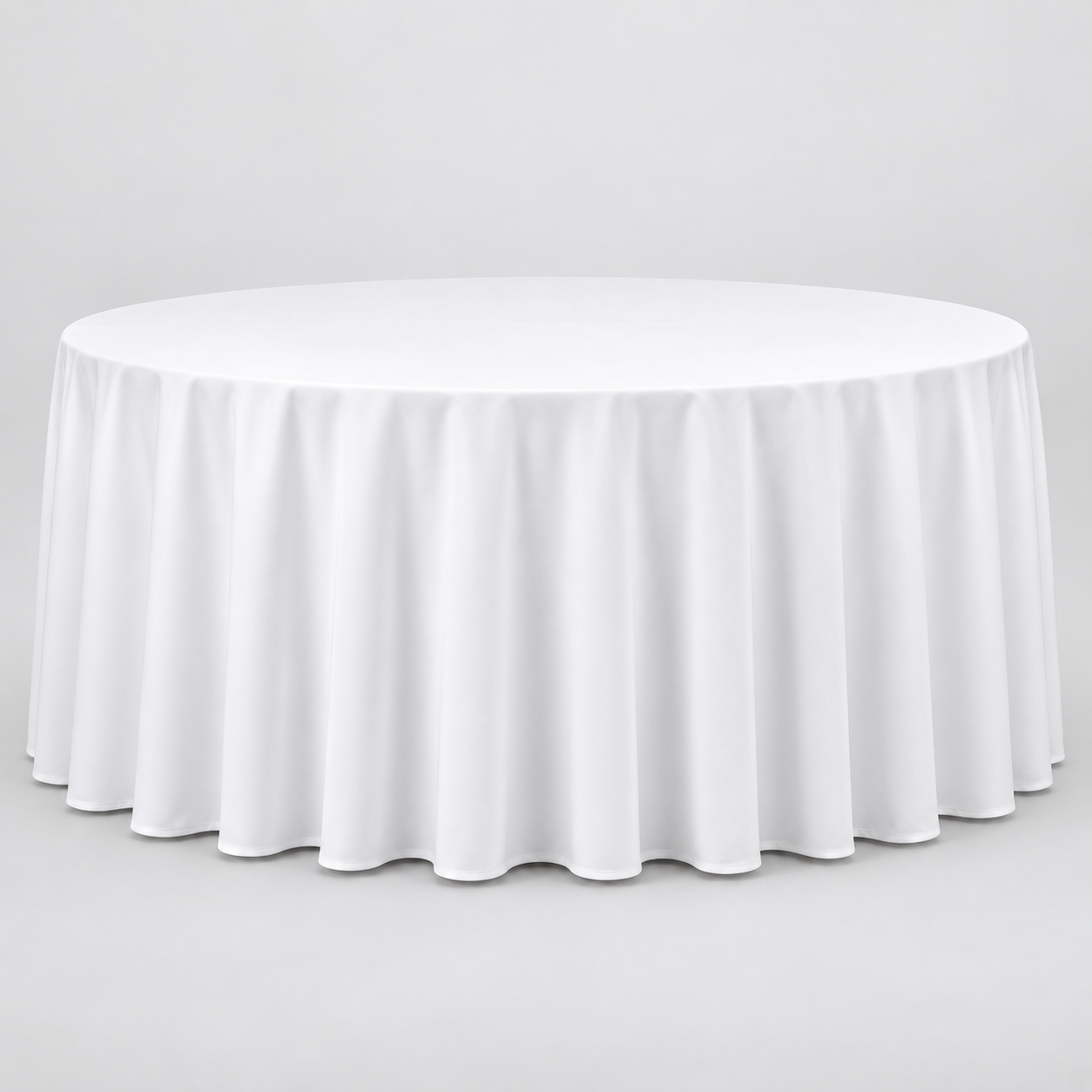 72-inch round table dressed with a white 132-inch floor-length linen that reaches the ground