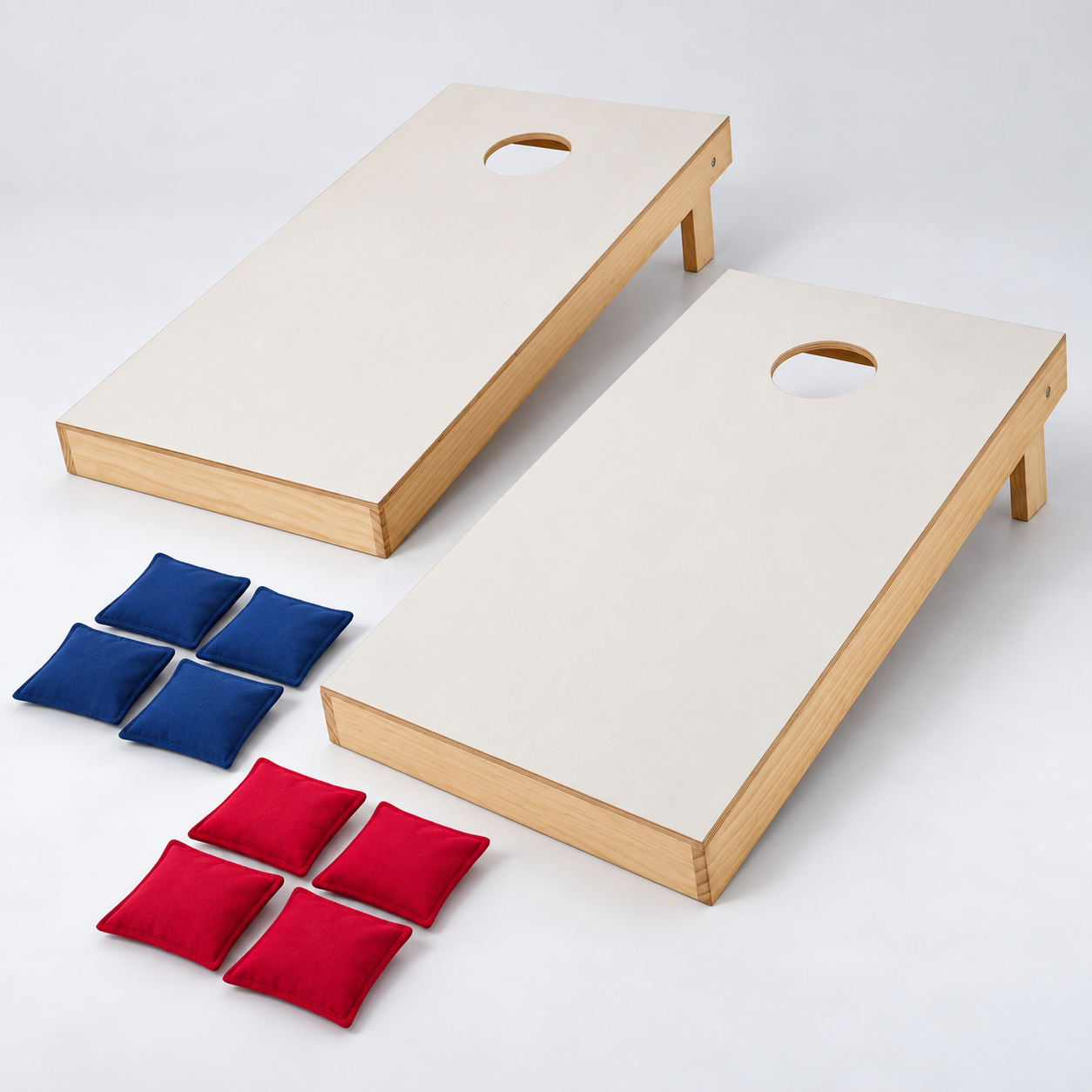 Two regulation-size cornhole boards with red and navy beanbags